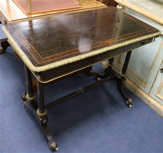 A Victorian ebonised card table W.92cm